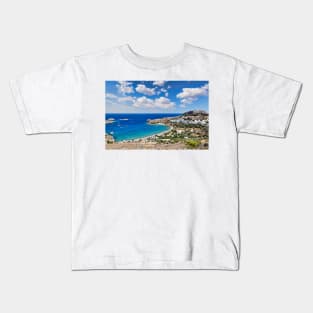 The village of Lindos with a beautiful bay, medieval castle and pictursque houses on a hill is the star of Rhodes, Greece. Kids T-Shirt